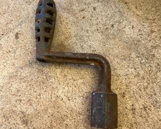 Old hand crank to start farm equipment or other machinery.