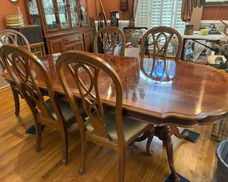 Available for presale- Dining room table and six chairs in very good condition with custom table pad.  Contact us by email or text for more information.
