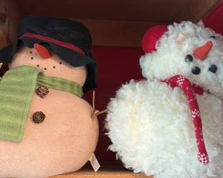 plush snowman and santa claus figurines