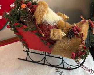 christmas stocking with furry figure in sleigh