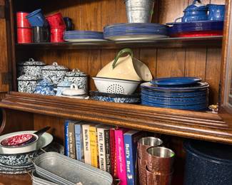 A very large tin collection. There are several designs. A Collection of Bells best cookbooks LA MS AND AL. These are in the kitchen. The other cookbooks are in the den.
