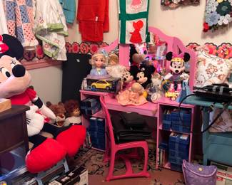 Quilt tops, she cleaned pressed and sealed them up. Child’s vanity. Painted school desk. 3 DVD players.