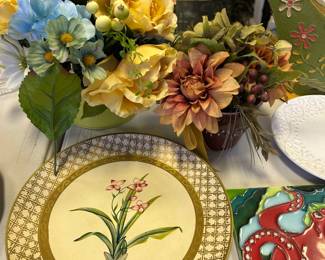 Artificial flowers and assorted dishes