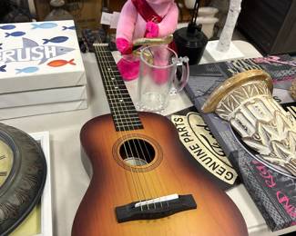 Small guitar and a singing pig!