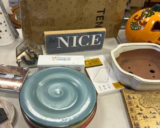 Different signs with sayings, dishes