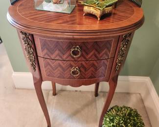 Charming Accent Table with Inlay Details and Gallery Rail
