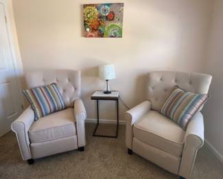 Matching chairs that massage and recline.