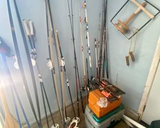 Assorted fishing poles, tackle boxes filled with lures and X-C ski boots/poles