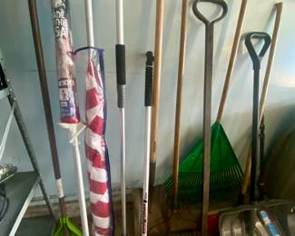 Assorted lawn tools, shovels and flags