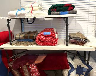 A FEW BLANKETS, TABLE RUNNERS AND THROW PILLOWS.