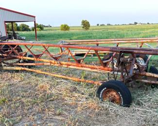 ROUND BALE HAY HAULER NEEDS ATTENTION.
