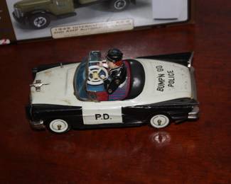 Antique toy wind up 'Bump & Go' police car  complete & works