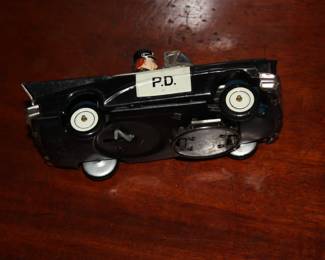 Antique toy wind up 'Bump & Go' police car  complete & works