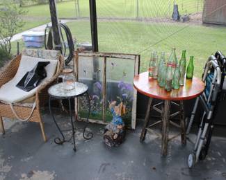 WICKER CHAIR AND A BEAUTIFUL STAIN GLASS WINDOW