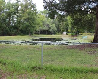 HOME AND PROPERTY ARE FOR SALE, LARGE PIECE OF PROPERTY WITH A STOCKED POND