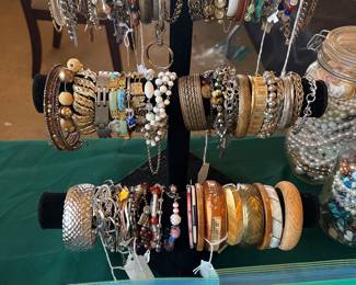 Stand with bracelets sold as a lot