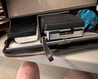 vintage polaroid camera in the large case