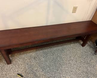 one of a pair of wooden benches