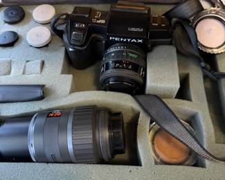 Vintage Pentax in a hardshell case complete with lenses