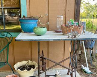 TABLE WITH SEWING MACHINE BASE, PLANTERS AND PLANTS