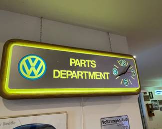 Original vintage VW Parts department clock. 16” tall, 46” wide, lights/ clock work