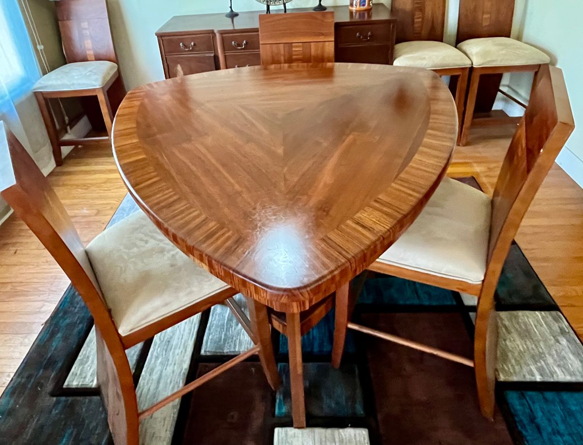 Dining table and 6 chairs. One chair has a broken rung