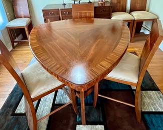 Dining table and 6 chairs. One chair has a broken rung