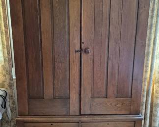 This stunning cabinet is in the bedroom at the end of the hall.  Inside is full of shelves.