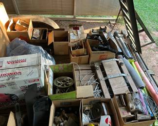 More golf cart parts and some t-pole fence poles and drivers