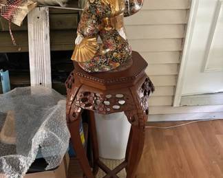 asian women wth asian plant stand