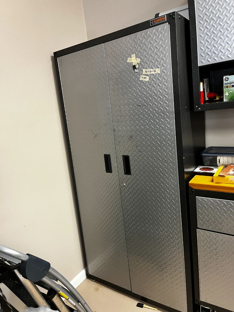 #422	Gladiator Cabinet 36x18x72. Has key 3 shelves	 $245.00 			
