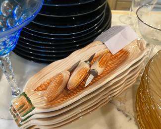 #547	6 vintage corn plates with 3 corn cob holders	 $30.00 			
