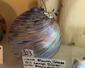 #323	Handblown glass oil lamp. Silver w blue and purple 	 $12.5 			
