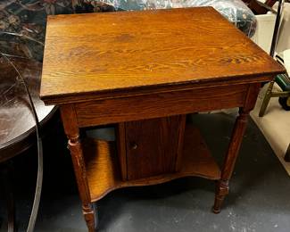 #437	Oak table with flip top mirror and storage door at base 27x22x30	 $120.00 			

