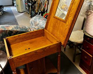 #437	Oak table with flip top mirror and storage door at base 27x22x30	 $120.00 			
