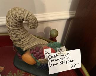#321	Cast Iron Cornucopia door stopper	 $14.00 			
