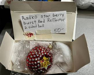 #489	Christopher Radko star berry burst red reflector 2 sided ball	 $50.00 			
