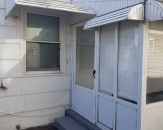 Storm door; enclosed porch; aluminum dormers