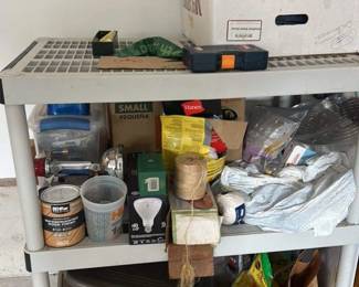 Assorted Household Items on Shelving Unit 