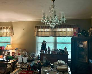Numerous Christmas plates and decor.