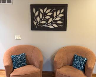 Elegant club chairs, wall art