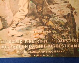 Two predators meet. One has the Remington. Metal sign.