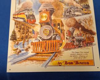 Metal sign depicting the history and different stages of railroad locomotive.