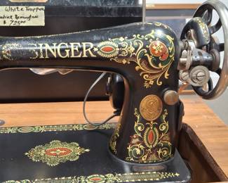 1910 Singer Sewing machine. It has been converted to electric, was tuned up and never used since. Comes with the cabinet.