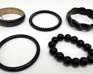 5 Vintage Bangle Bracelets Including Carved Wood
Lot #: 132