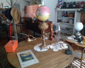 1880s banquet org bradly & hubard kero lamp.
Round oak tables from $100