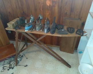 Small collection of rare  irons and trivets with vintage ironing board display stand First $200 takes it all