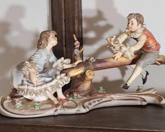 Young Lovers on See Saw Porcelain Figurine