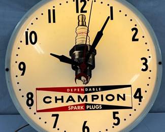 16in. Champion Spark Plugs Advertising Clock with Plastic Face by Neon Products Inc.