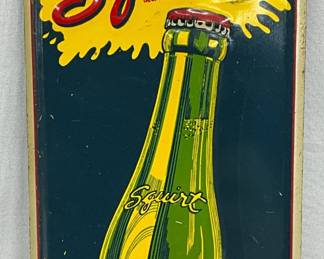 Emb. 1957 Tin Squirt Advertising Sign, 4×9 Inches